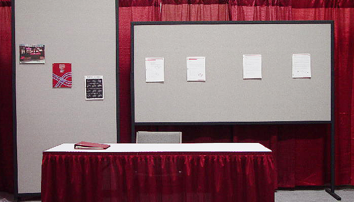 Trade-show metal frames holding fabric display panels
